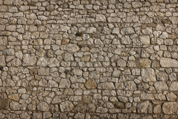 Wall Mural - abstract background old gray stone wall closeup