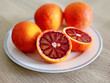 oranges in the plate - tarocco blood orange - sanguine orange - red orange