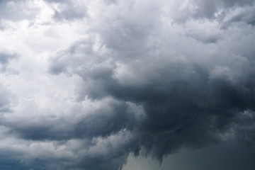 Wall Mural - dark, grim, stormy, rainy sky with rays of light. scary hurricane clouds. natural element. stock pho