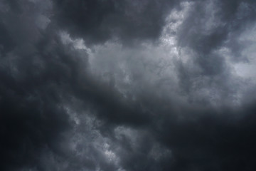 Wall Mural - dark, grim, stormy, rainy sky with rays of light. scary hurricane clouds. natural element. stock pho