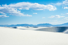 White Sand Dunes And Blue Cloudy Sky In New Mexico Desert