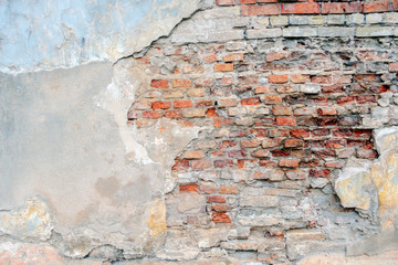 Wall Mural - Old grungy red brick wall with peeled white beige stucco background. Vintage retro plaster wall with dirty cracked scratched texture background