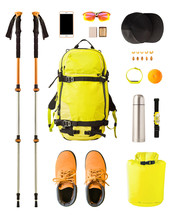 Flat Lay Of Sport Equipment And Gear For Hiking And Trekking. Top View Of Walking Poles, Backpack, Food, Boots, Etc. Isolated On White Background