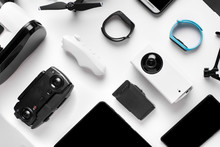 Glasses And Camera Near The Smart Watch, Background Image Of The Gadgets On White Surface