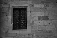 Window With Metal Lattice Black With Gray Stone Wall