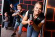 © JackF - Emotional girl with laser pistol playing laser tag with friends