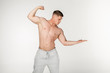 © Vasya - Attractive young bodybuilder motivated look, showing his pumped biceps