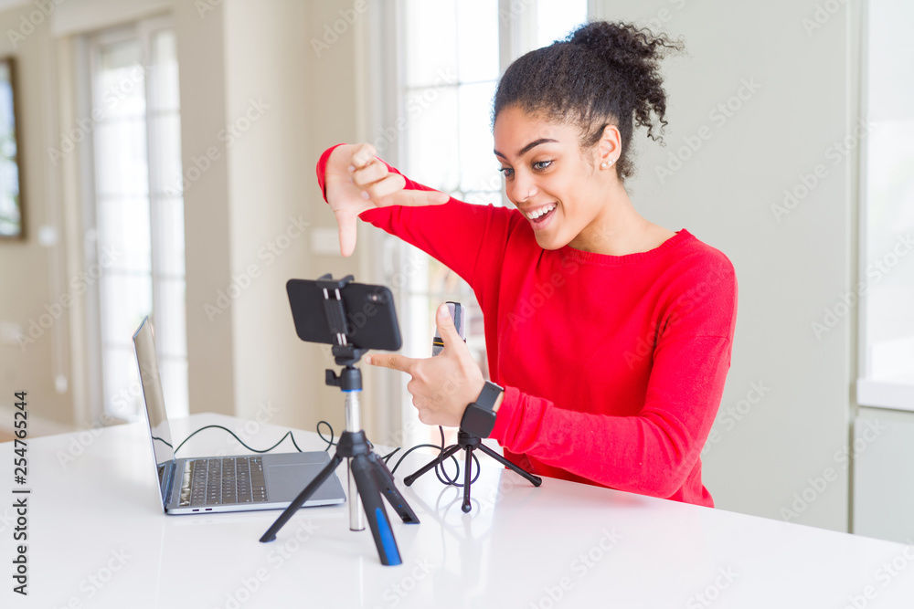 Young african american woman doing video call using smartphone camera ...