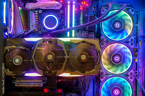 Close-up and inside Desktop PC Gaming and Cooling Fan CPU with multicolored LED RGB light show status on working mode, interior PC case technology background