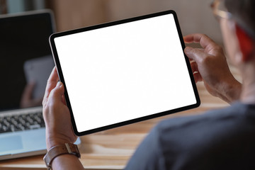 Canvas Print - man holding and using blank screen tablet