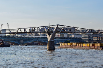 People Crossing the Millenium Bridge over the Thames