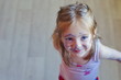 © Julia - Portrait of a little girl face dirty from marker pen . Funny little girl with paint stained face