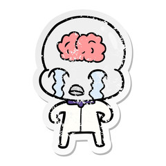 distressed sticker of a cartoon big brain alien crying