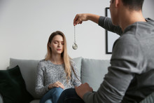 Young Woman During Hypnosis Session In Psychologist's Office