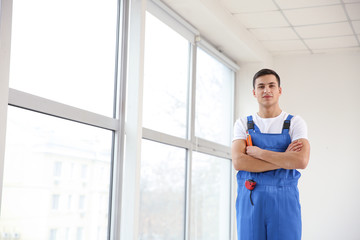 Sticker - Young worker in room with big windows