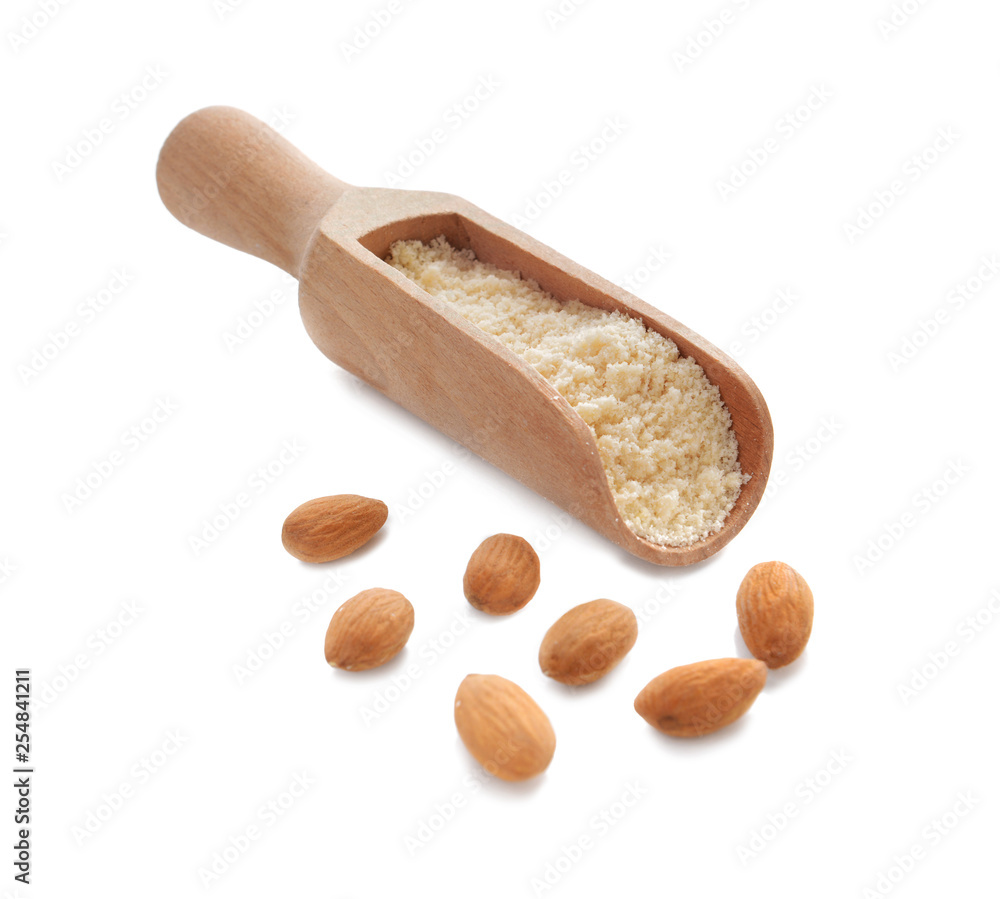 Scoop with almond flour on white background