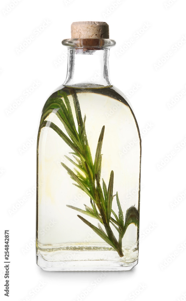 Bottle with rosemary oil on white background