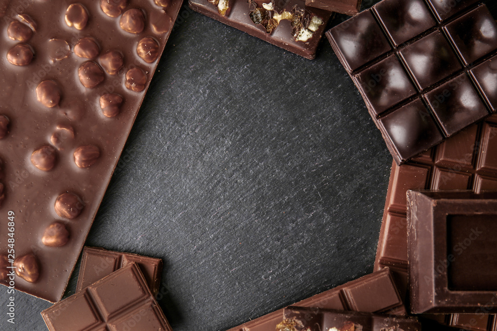 Frame made of tasty chocolate on dark background