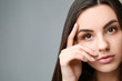© Pixel-Shot - Portrait of beautiful woman with healthy skin on grey background