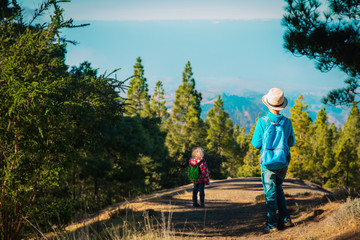 kids -boy and girl -travel in nature, family hiking