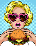 Fototapeta Młodzieżowe - Vector color pop art comic style illustration of a girl eating a cheeseburger. Beautiful business woman holding a big hamburger. Successful young lady with open mouth bites a huge burger