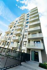 Modern residential apartment house building with entrance gate