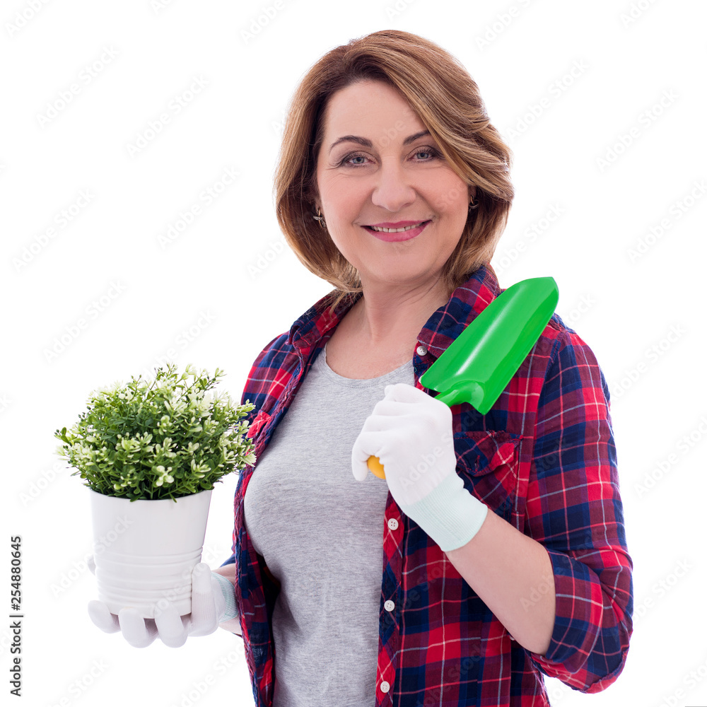 portrait of mature woman with potted plant and small shovel isolated on ...