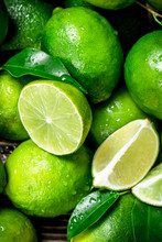 Pieces Of Fresh Lime With Leaves.
