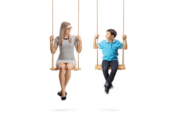 Poster - Young woman and a little boy on swings looking at eachother