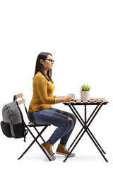 Poster - Female student sitting in a cafe with a cup of coffee