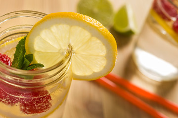 Wall Mural - cold soda with lemon mint and berries in glass jar