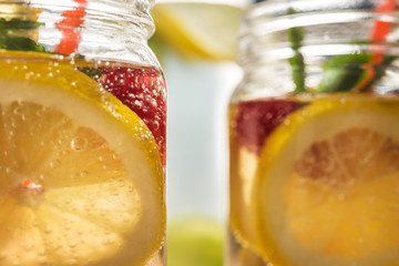 Wall Mural - cold summer refreshment in glass jar with lemon