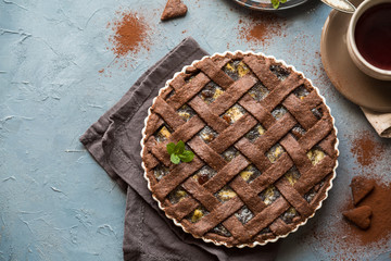 Wall Mural - Breakfast with a chocolate pie made from integral flour (only) stuffed with: apples, pears, poppy seed, raisins.