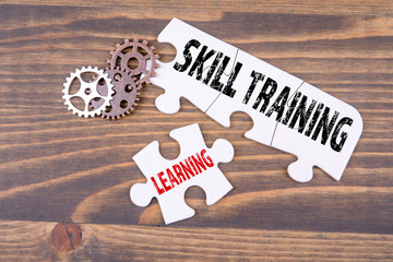 Wall Mural - Skill training and learning concept. White puzzle on a wooden table