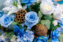 Artificial Navy Blue Orchid Flower With Wooden Decoration Balls Close Up On Blurred Background.