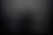 Background In A Black, Soft Color Illuminated With A Delicate Light.
