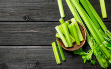 Pieces Of Celery In A Wooden Bowl.