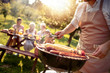 © ivanko80 - Man preparing food on garden barbecue