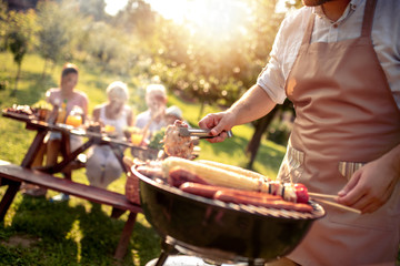 Sticker - Man preparing food on garden barbecue