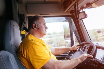 Man driving on a highway on the road in rural landscape