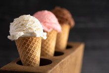 A Line Of Three Classic Flavors Of Ice Cream In A Wooden Sugar Mold