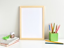 White Desk With Photo Frame Mockup, Books, School Supplies.