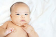 © StockerThings - Newborn baby girl on white towel after done shower