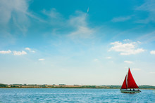 Sail Boat On Calm Water
