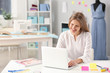 © Pixel-Shot - Beautiful female business owner working in atelier