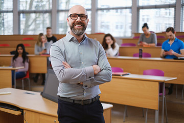 Lecturer and multinational group of students in an auditorium