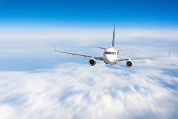 Modern airplane mith motion blur effect travel at sunny bright day