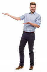 Wall Mural - full length portrait of young man pointing
