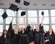 © Nejron Photo - Multi ethnic group of graduated students throwing hats