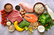 Assortment of healthy protein sources and body building food : meat, fish, fruits, vegetables, legumes, nuts, cereals and dairy products.Top view with copy space.